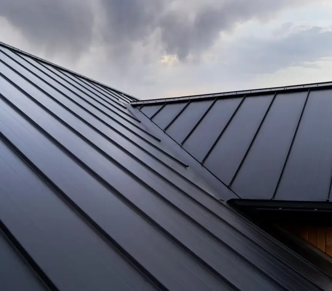 Close-up of a dark standing-seam metal roof